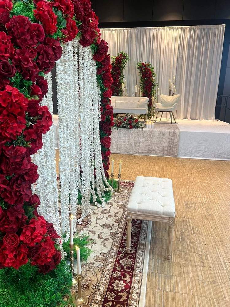 Luxe Nikkah divider with rich floral styling and bench seating